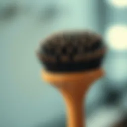 A close-up of a specialized brush designed for scalp care
