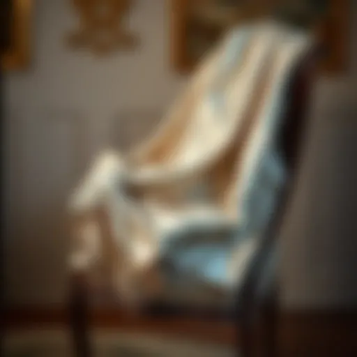 Elegantly draped metallic silver shawl over a vintage chair