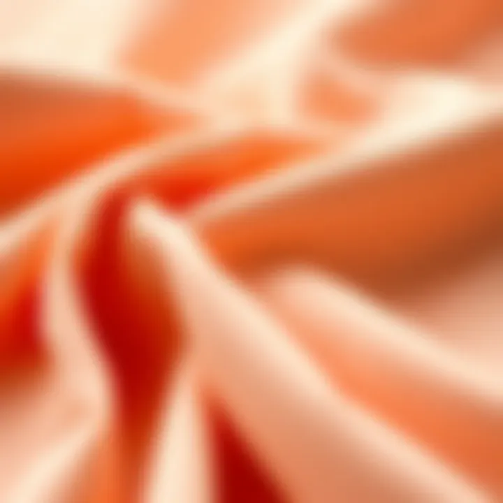 A close-up of various peach fabric swatches showcasing texture and quality.
