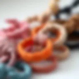 A close-up view of various knotted elastic hair ties showcasing different colors and textures