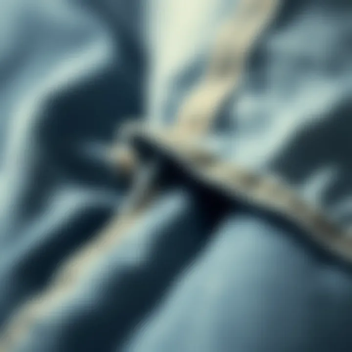 Close-up of raw hem detailing on denim