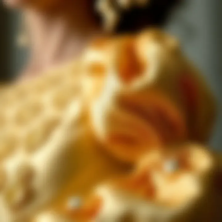 Close-up of the intricate design details of a gold puff sleeve dress
