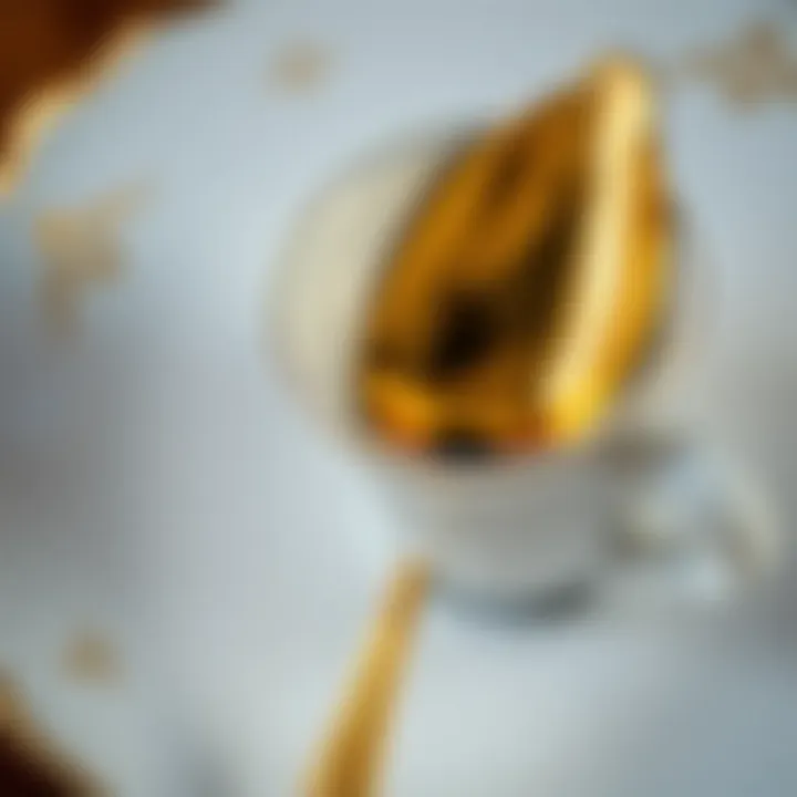 Elegance in Design Elegant gold espresso spoon resting on a fine china saucer