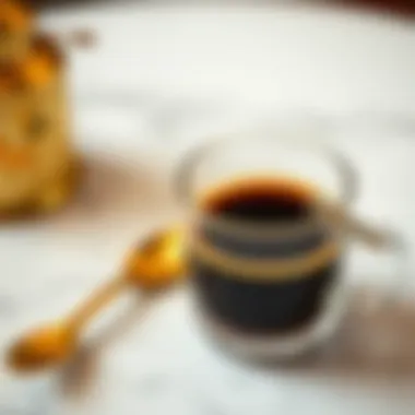 Elevating the Espresso Experience Gold espresso spoon alongside a cup of rich espresso